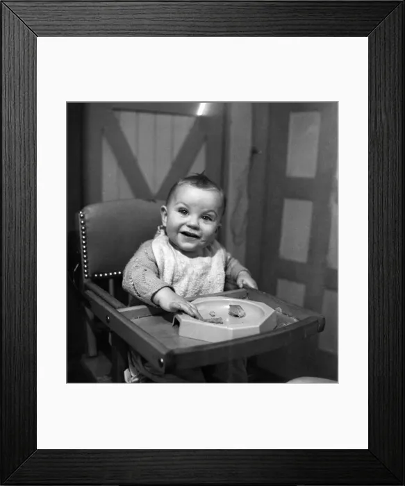 Framed Print : Expressions. An 11 month old child smiling with his food. January 1950 Framed Print : Expressions. An 11 month old child smiling with his food. January 1950