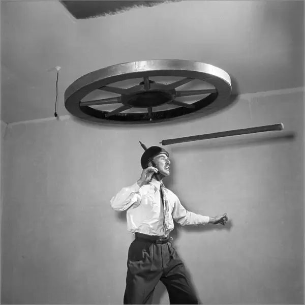 Henri Vadden holds an 80lb cartwheel on a pole which he then places on his chin
