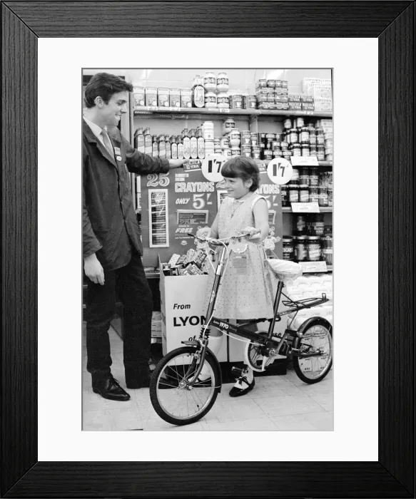 Framed Print : Angela Moore is pictured in a Coventry store with her new bicycle which she won in a Framed Print : Angela Moore is pictured in a Coventry store with her new bicycle which she won in a