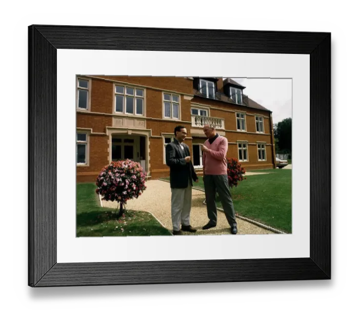 Framed Print : Henry Cooper Boxing and sports personality with his son Henry Jr outside his house Framed Print : Henry Cooper Boxing and sports personality with his son Henry Jr outside his house