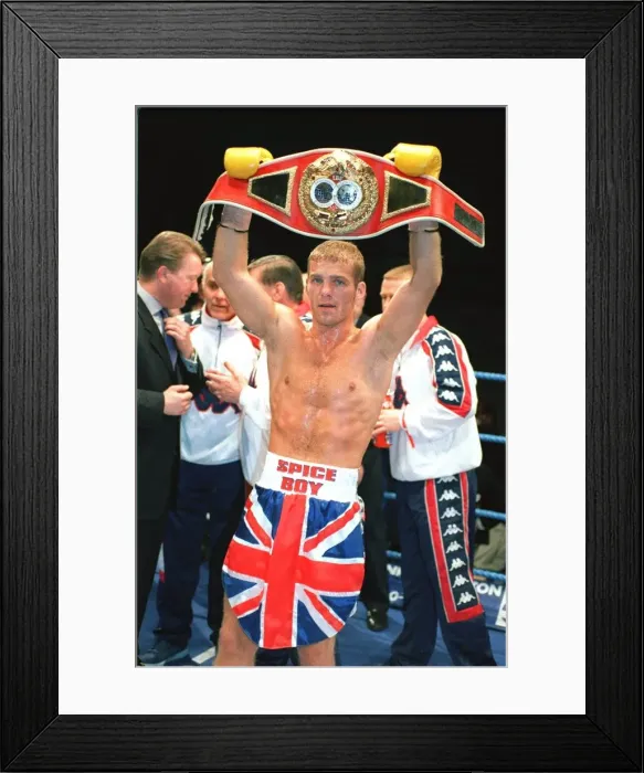 Framed Print : Ryan Rhodes Boxer standing in the ring holding belt celebrates after winning the IBF Framed Print : Ryan Rhodes Boxer standing in the ring holding belt celebrates after winning the IBF