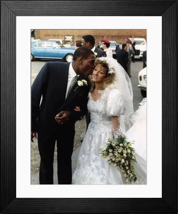 Framed Print : Frank Bruno Boxer gives his wife Laura a kiss after the ceremony