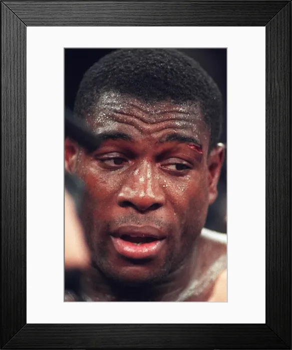 Framed Print : Frank Bruno looks despondent after losing his WBC world title to Mike Tyson in Las Vegas