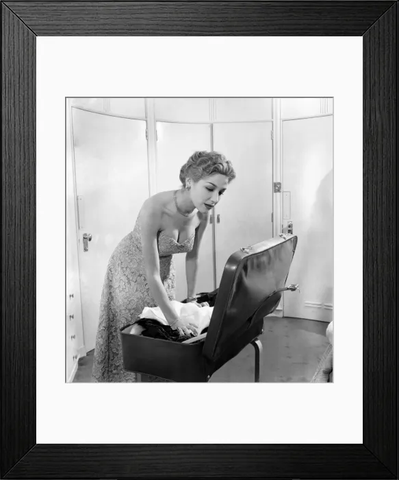 Framed Print : Cosetta Greco-Cosetta packing her case in preparation for leaving the film festival