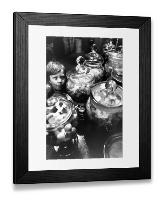 Framed Print : Three year old Christopher Kerr got a big bag of sweets for tuppence at the rebuilt Co-op Framed Print : Three year old Christopher Kerr got a big bag of sweets for tuppence at the rebuilt Co-op