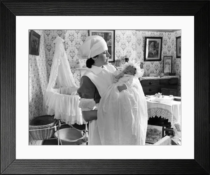 Framed Print : Fran Mileman and her eight week old baby Alexander in the nursery at Beamish Museum Framed Print : Fran Mileman and her eight week old baby Alexander in the nursery at Beamish Museum