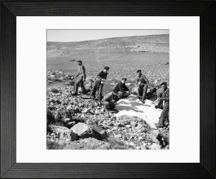 Framed Print : British soldiers on the way back from Wadi Pouse stop for a snowfall fight in Jordan