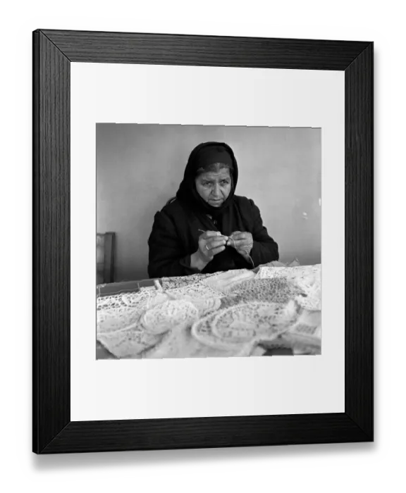 Framed Print : Old Greek Woman sewing lace at her stall in a Cyprus town market March 1952