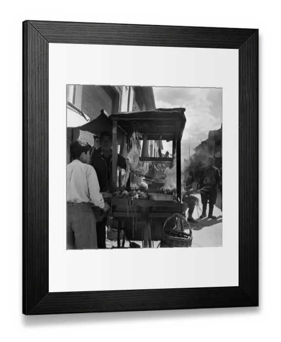 Framed Print : Local people buying meat at a market stall in a town in Cyprus Framed Print : Local people buying meat at a market stall in a town in Cyprus