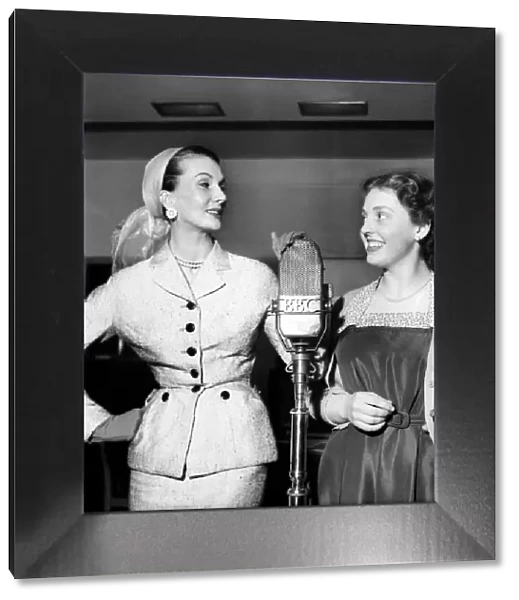 Mannequin Barbara Goalen with fellow model Jeanette Swan in rehearsal for the radio