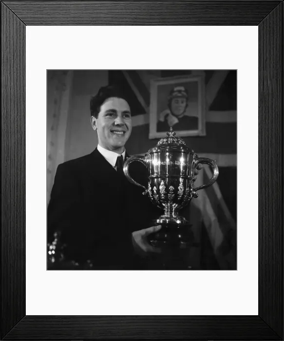 Framed Print : Motorcycle racing champion Geoff Duke with the World Championship trophy