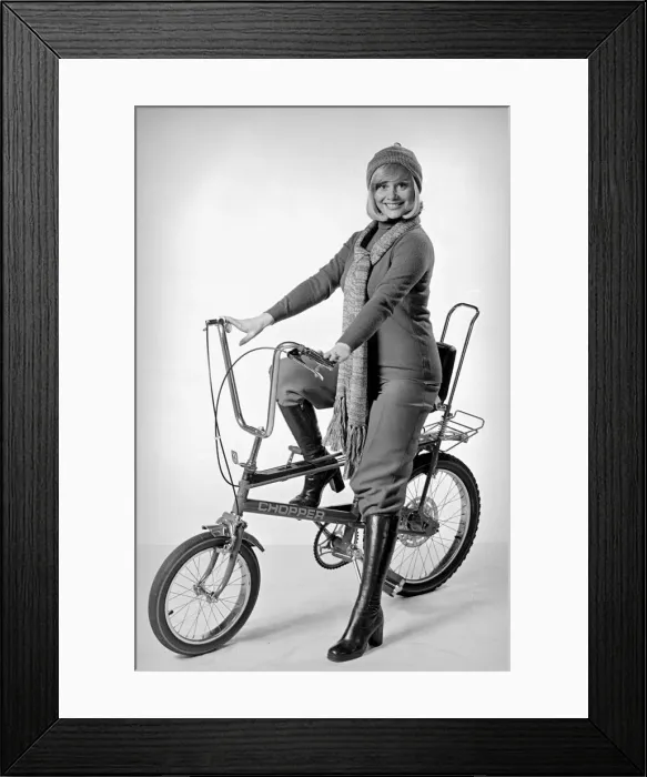 Framed Print : Ann Aston seen here in the studio modelling the new Chopper bike Circa 1975 Framed Print : Ann Aston seen here in the studio modelling the new Chopper bike Circa 1975