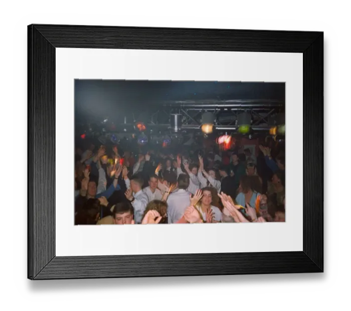 Framed Print : Clubbers get hot and sweaty enjoying a rave