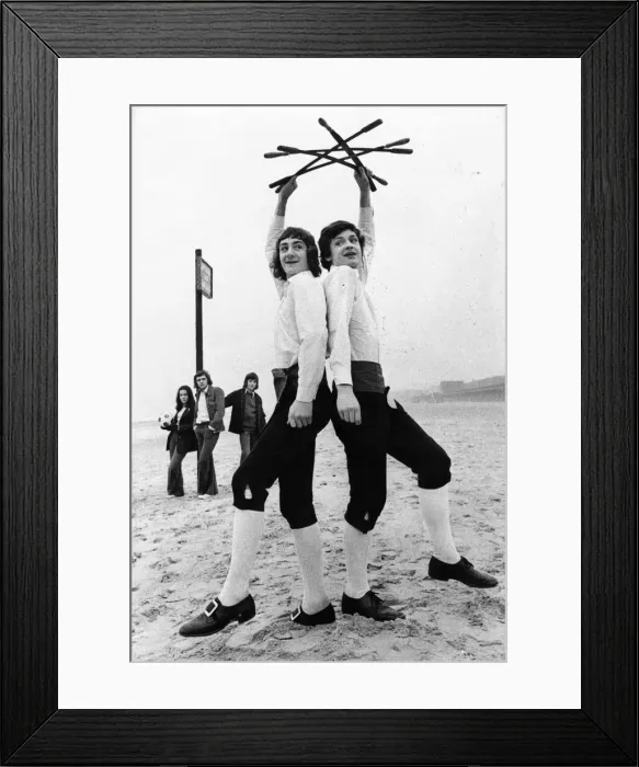 Framed Print : Morris dancing brothers Timothy and Nicholas Bristow practice on the beach at Whitley Bay