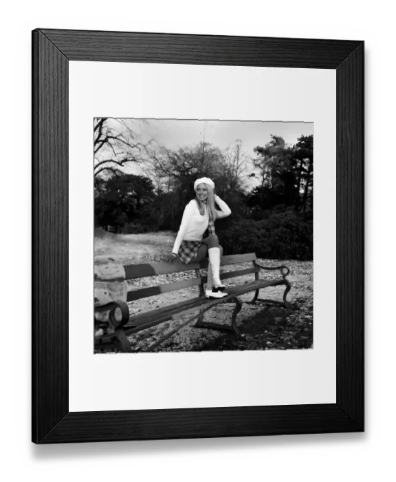 Framed Print : A mini kilt and skinny sweater aren t the ideal clothes for a chilly winter Framed Print : A mini kilt and skinny sweater aren t the ideal clothes for a chilly winter