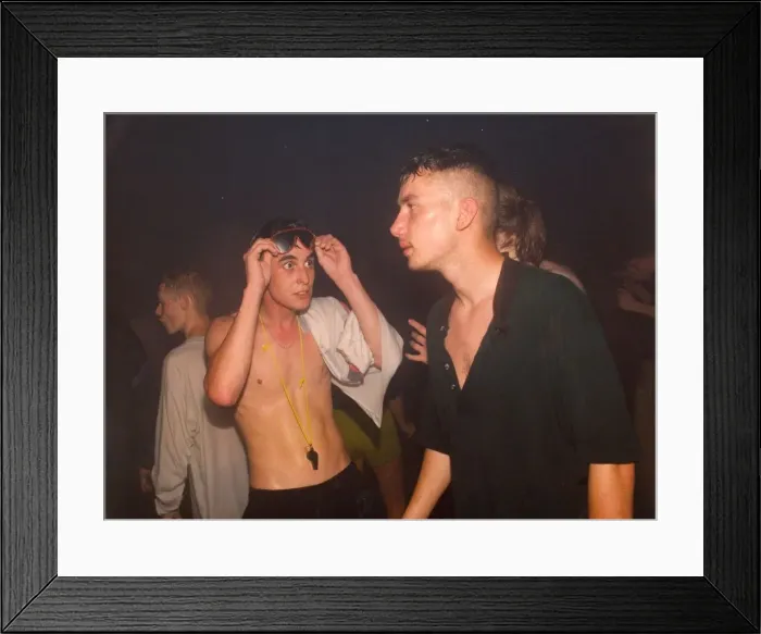 Framed Print : Clubbers get hot and sweaty enjoying a rave