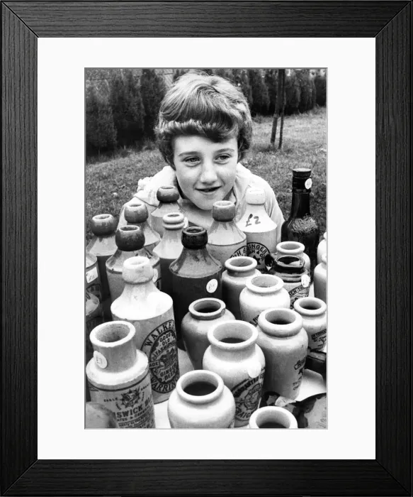 Framed Print : Ten year old Tracy Milles looks after her dads bottle stall Framed Print : Ten year old Tracy Milles looks after her dads bottle stall