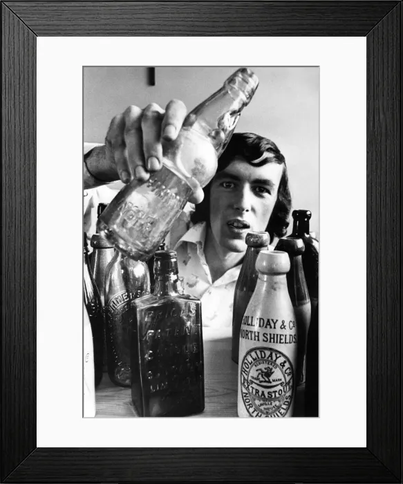 Framed Print : Teacher Mike Pickering with his collection of Victorian bottles Framed Print : Teacher Mike Pickering with his collection of Victorian bottles