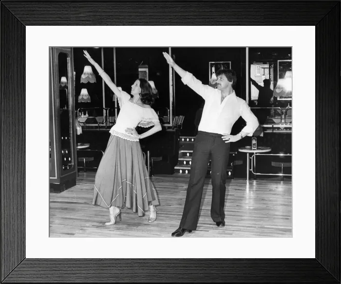 Framed Print : A couple show us how the Tango Hustle is done