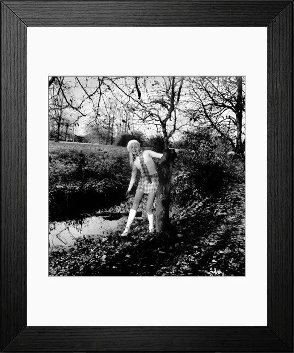 Framed Print : A mini kilt and skinny sweater aren t the ideal clothes for a chilly winter Framed Print : A mini kilt and skinny sweater aren t the ideal clothes for a chilly winter