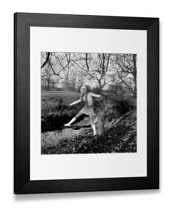 Framed Print : A mini kilt and skinny sweater aren t the ideal clothes for a chilly winter Framed Print : A mini kilt and skinny sweater aren t the ideal clothes for a chilly winter