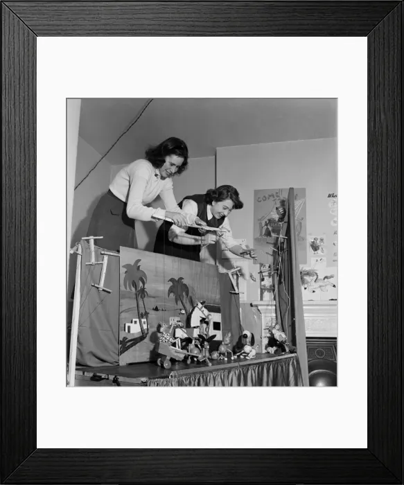 Framed Print : Baley and mother puppet show. March 1953 D106-001 Framed Print : Baley and mother puppet show. March 1953 D106-001