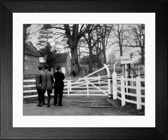 Framed Print : Three men standing at the gateway entrance to the animal park owned by millionaire John Framed Print : Three men standing at the gateway entrance to the animal park owned by millionaire John