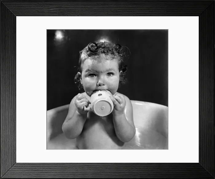 Framed Print : Bath time for one year old Kathleen Skelly is the happiest moments for her
