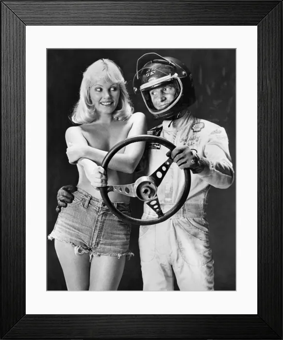 Framed Print : Ian Ashley and Angela Jay pose together holding a steering wheel Framed Print : Ian Ashley and Angela Jay pose together holding a steering wheel