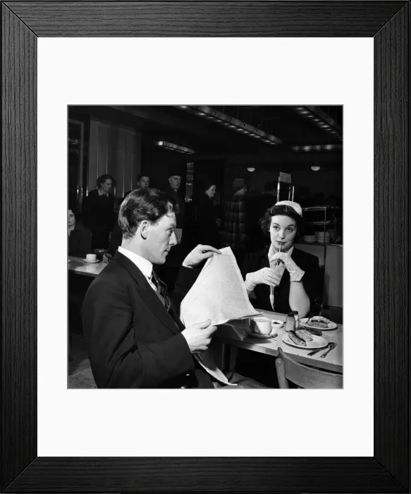 Framed Print : Shy boy and girl sitting together to have lunch in a canteen