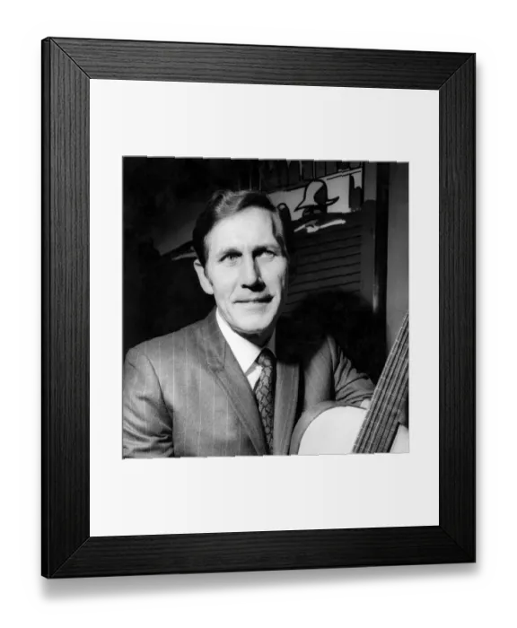 Framed Print : Chester Burton Chet'Atkins with a guitar he brought with him to present Framed Print : Chester Burton Chet'Atkins with a guitar he brought with him to present