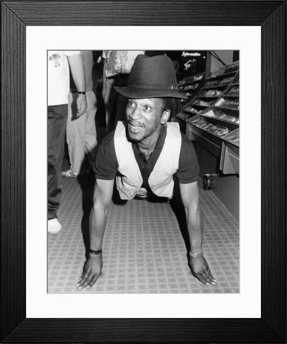 Framed Print : Brinsley from Aswad took part in a charity event, filling dustbins with albums to raise