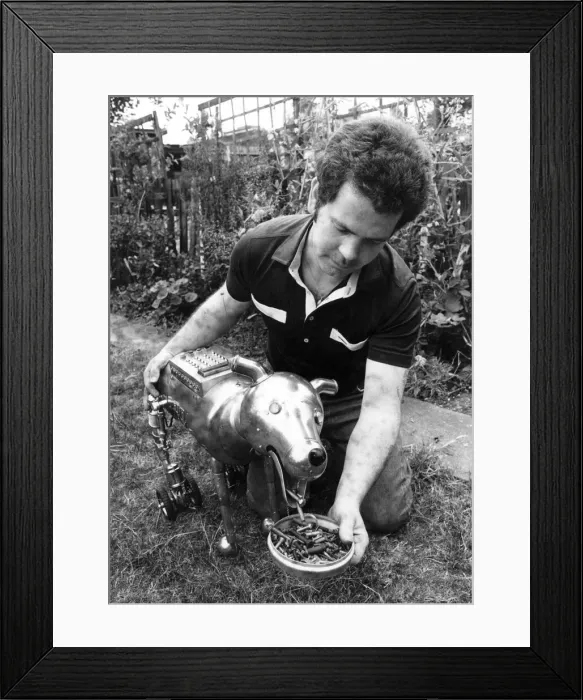 Framed Print : Steve Brooks of East London with his electric robot dog. August 1981 P018808