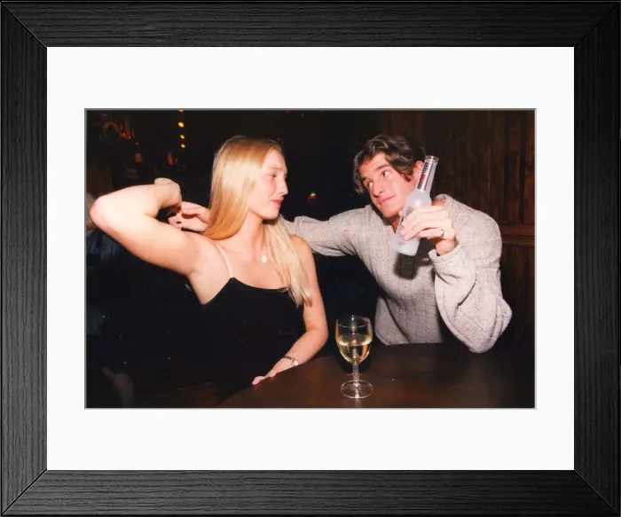 Framed Print : A woman fighting off the advances of a man in the pub - sexual harrassment