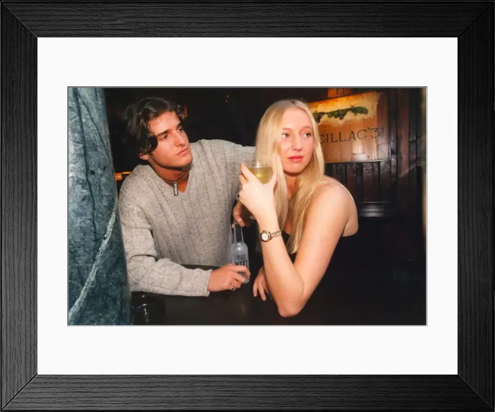 Framed Print : A woman fighting off the advances of a man in the pub - sexual harrassment
