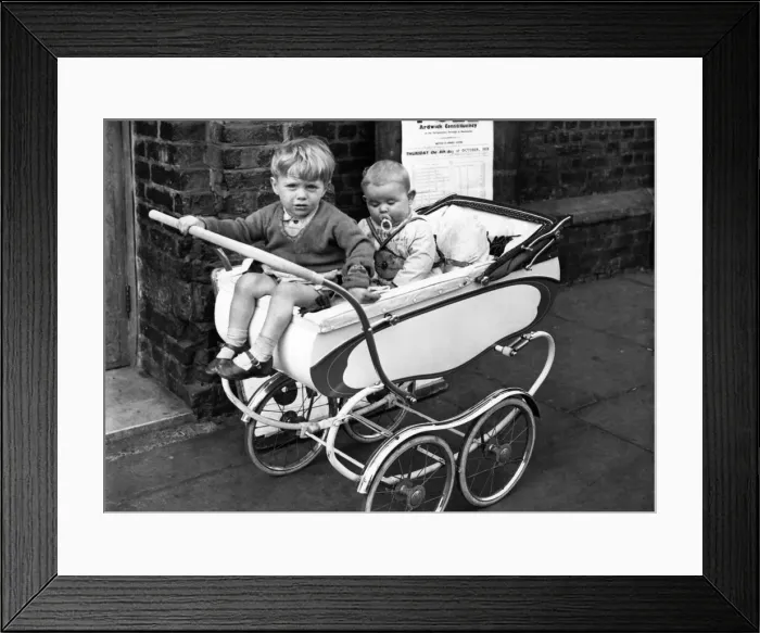 Framed Print : Children waiting in their pram outide the polling boothwhilst their mothers vote in Framed Print : Children waiting in their pram outide the polling boothwhilst their mothers vote in