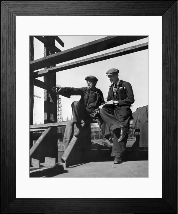 Framed Print : Two foreman, upon whom the efficiency of any shipyard belongs, scrutinize, with shrewd Framed Print : Two foreman, upon whom the efficiency of any shipyard belongs, scrutinize, with shrewd