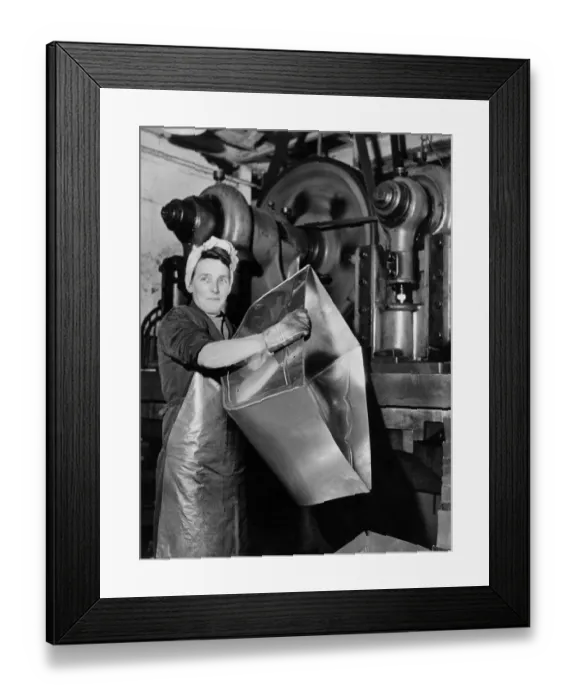 Framed Print : Women in Industry: Girl operates a 60 ton press and turns out pram bodies at one a minute Framed Print : Women in Industry: Girl operates a 60 ton press and turns out pram bodies at one a minute