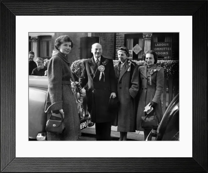 Framed Print : Mr. and Mrs. Clement Attlee and his daughters were out early this morning in a last Framed Print : Mr. and Mrs. Clement Attlee and his daughters were out early this morning in a last