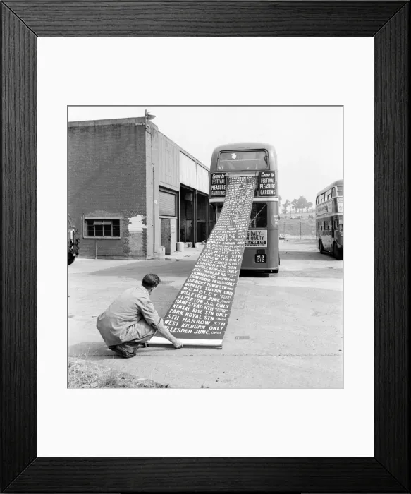 Framed Print : Worker at the Bus Depot winding up the destination indicator. August 1952 C4415 Framed Print : Worker at the Bus Depot winding up the destination indicator. August 1952 C4415