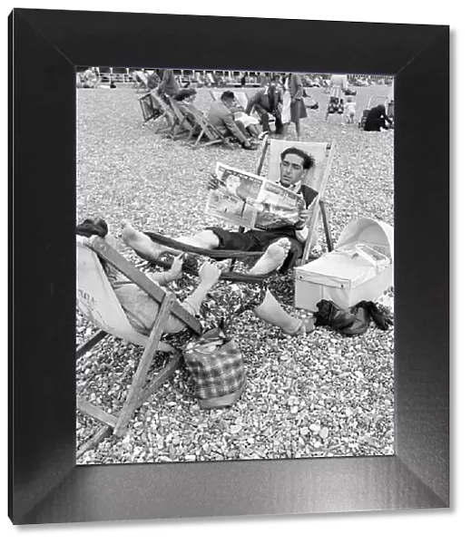Mr and Mrs. C. Clulow - at Brighton. Family on the beach at Brighton with their pet dog