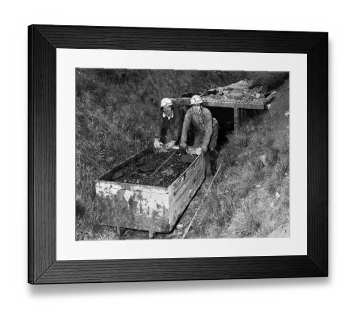 Framed Print : Two men pushing a cart full of coal in a mine. July 1978 P018160