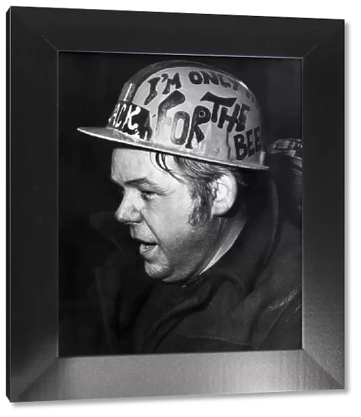 Coloured saftey helmets. Jackie Bevan (47) a circuit operator with I