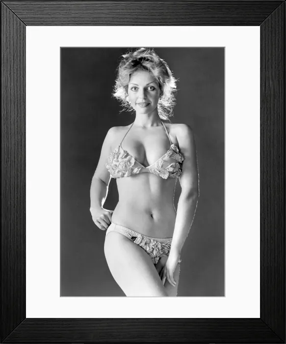 Framed Print : Girl wearing a pretty nylon bikini which is decorated with individual embroidered