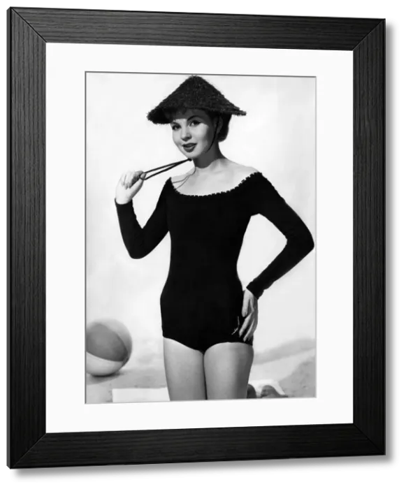Framed Print : Model wearing a one piece swimsuit. May 1957 P018065 Framed Print : Model wearing a one piece swimsuit. May 1957 P018065
