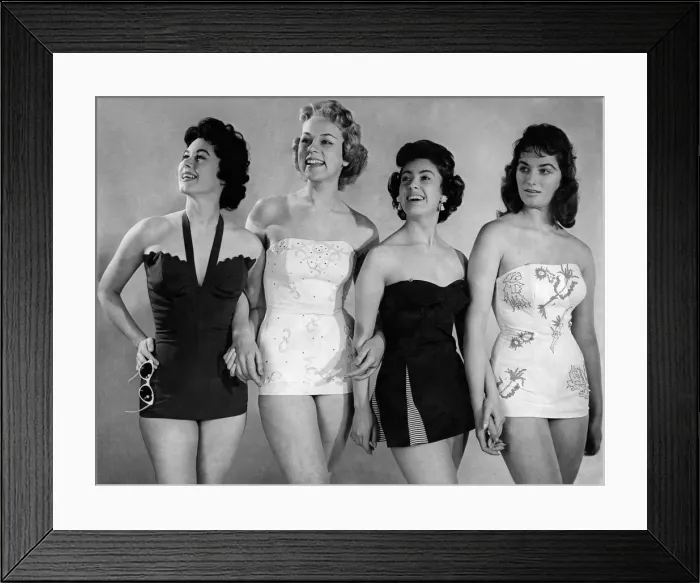 Framed Print : Four models wearing one piece swimsuits. March 1955 P018066