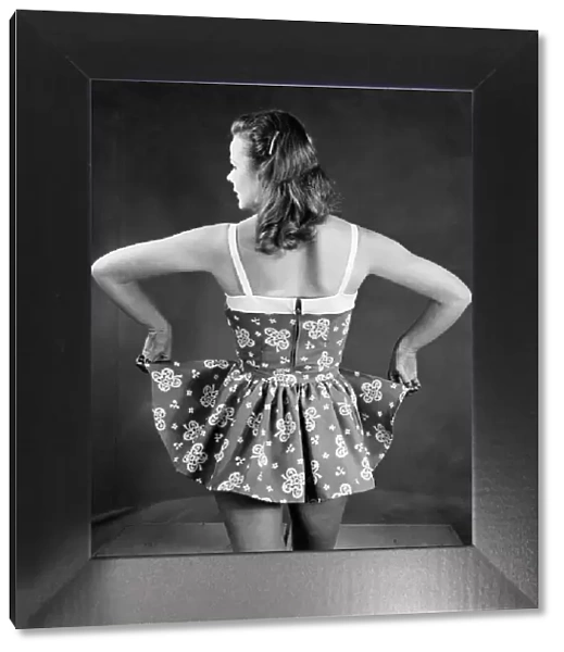 Woman wearing a short summer dress. April 1951 P018092
