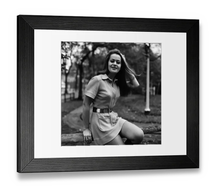 Framed Print : Woman wearing mini dress with belt across the waist and knee high boots Framed Print : Woman wearing mini dress with belt across the waist and knee high boots