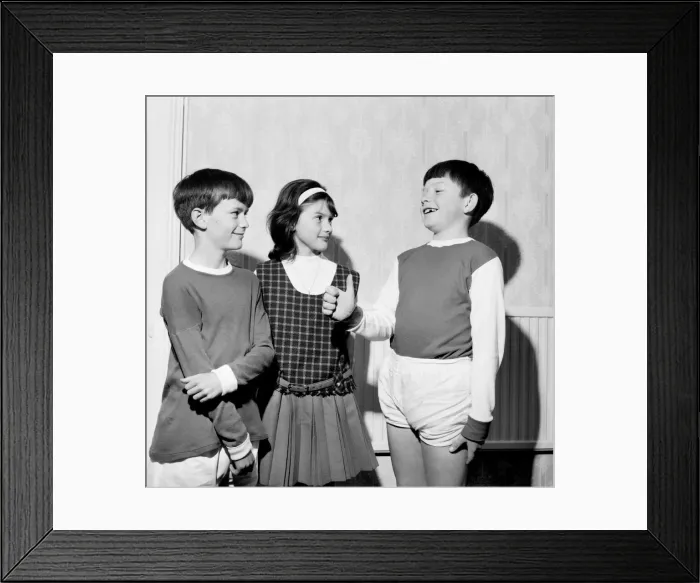 Framed Print : Young girl with a boy on either side of her October 1969 Z10456 Framed Print : Young girl with a boy on either side of her October 1969 Z10456