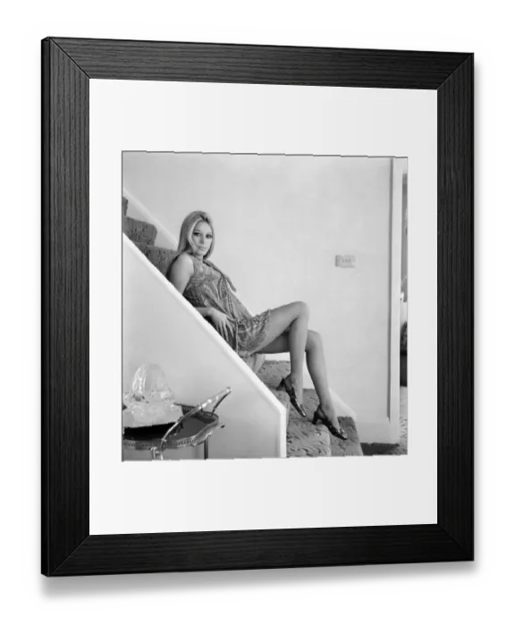 Framed Print : Woman posing on the steps of her house wearing psychadelic mini dress Framed Print : Woman posing on the steps of her house wearing psychadelic mini dress